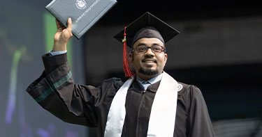 Graduate holding his degree