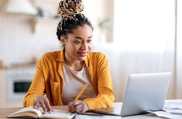 Girl looking at her computer