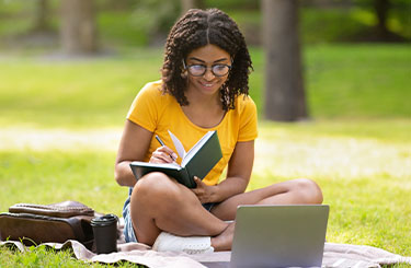 Girl studying outside