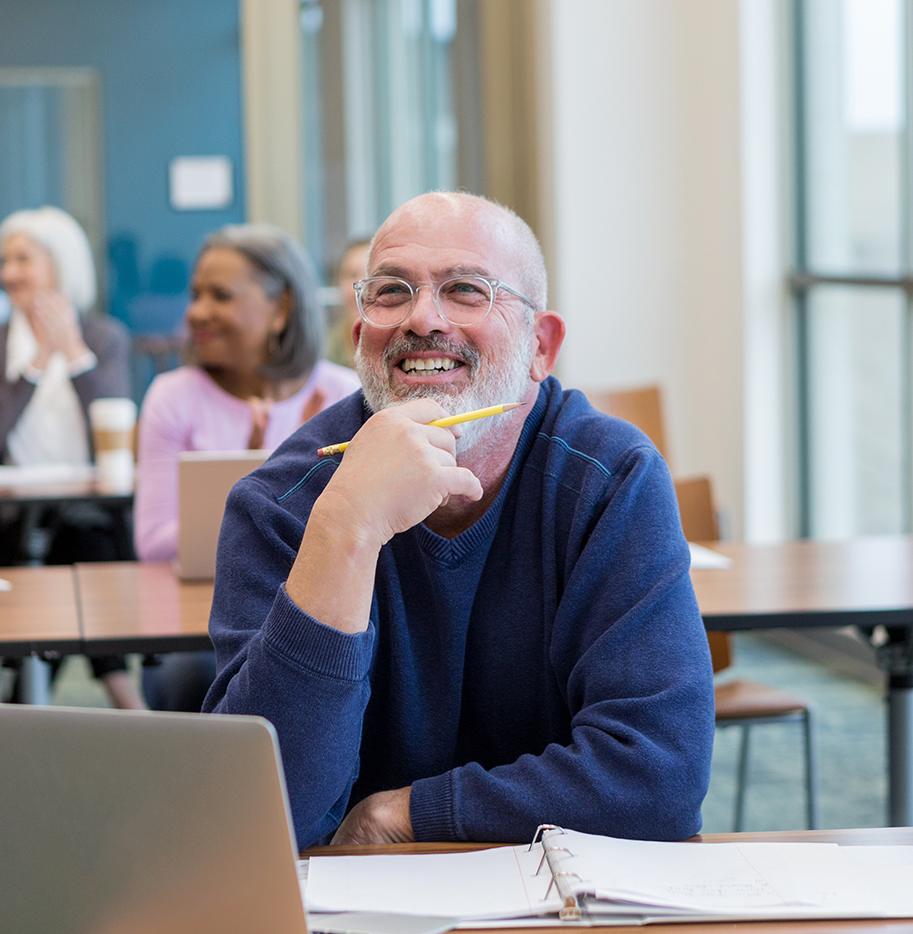 Man smiling in classroom