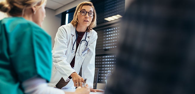 Doctor talking to a group