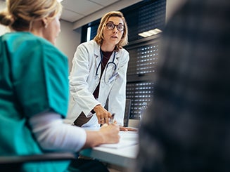 Doctor talking to a group