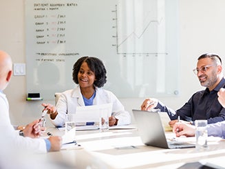 Group of doctors talking around a table