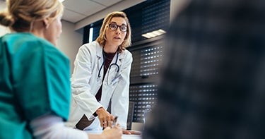 Doctor talking to patients