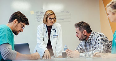 Doctor talking to a group