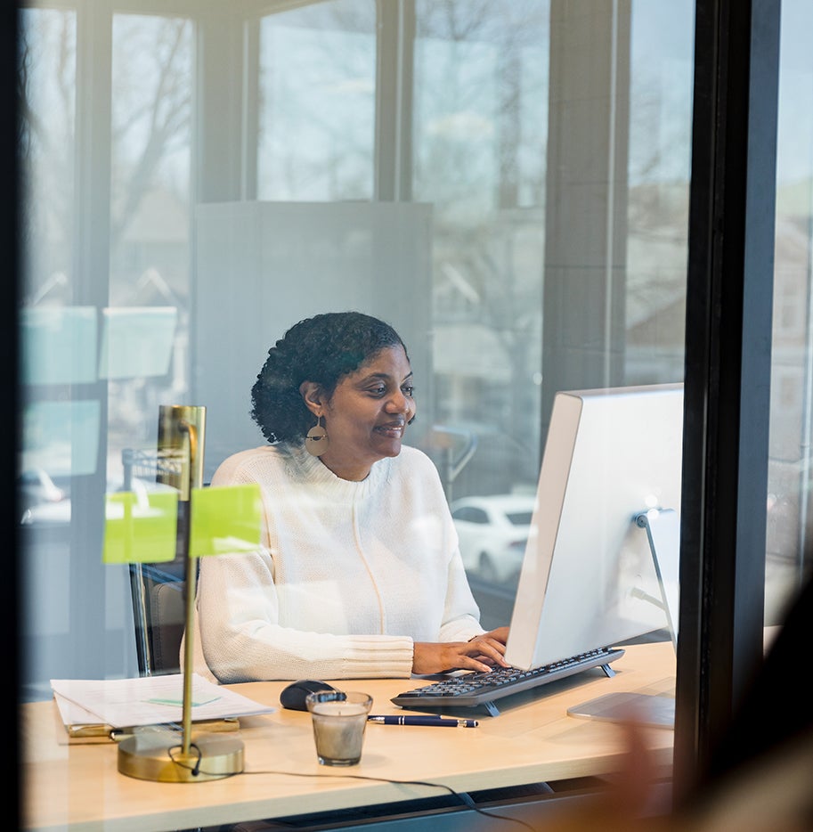 Woman sitting working on computer