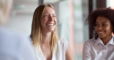 Two girls smiling