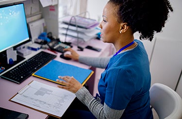 Nurse working on a computer