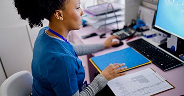 Nurse working on a computer