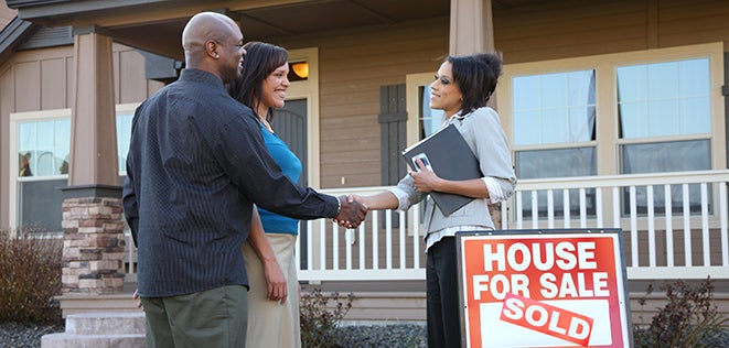 Couple closing on a house