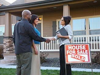 Couple closing on a house