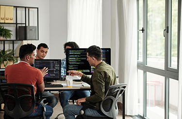 Group sitting working on computers